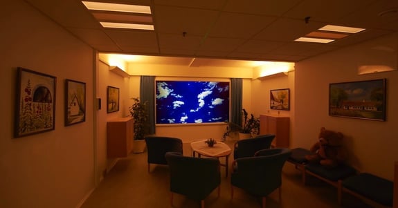 Sensory room at the Care Center Lindehaven with circadian lighting and a large screen for the demented residents